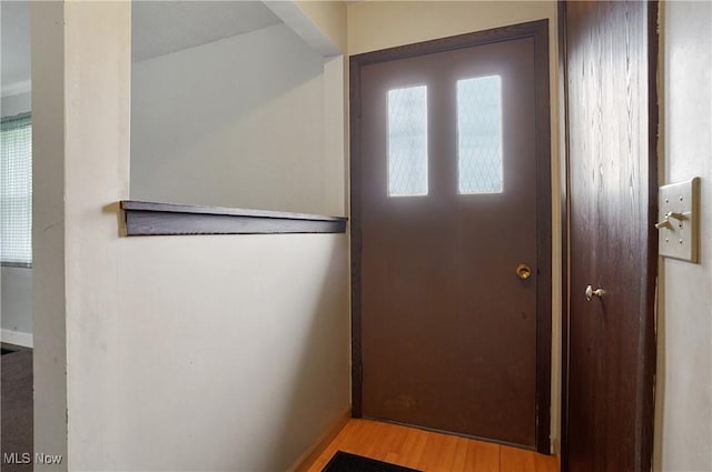 12230 Painesville Warren Rd, Concord, OH 44077 - doorway to outside featuring wood finished floors