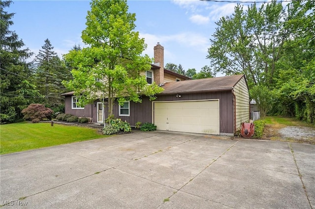 12230 Painesville Warren Rd, Concord, OH 44077 - view of front of home featuring an attached garage, driveway, a chimney, and a front lawn