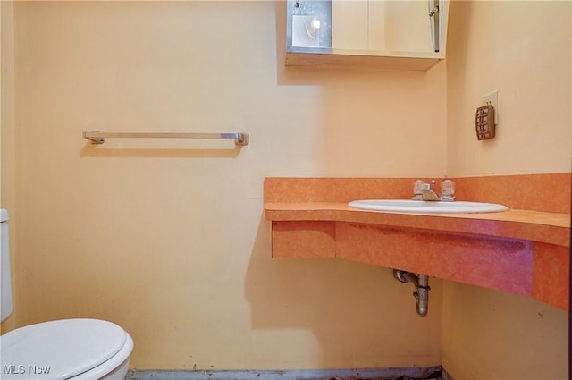 12230 Painesville Warren Rd, Concord, OH 44077 - bathroom with toilet and a sink