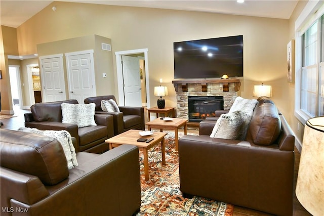 12 Bayview Cir, Cortland, OH 44410 - living room featuring vaulted ceiling and a fireplace