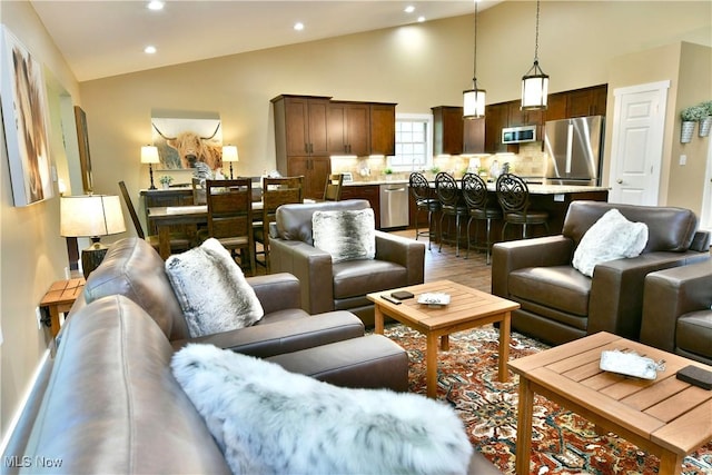 12 Bayview Cir, Cortland, OH 44410 - living area with wood finished floors, recessed lighting, and high vaulted ceiling