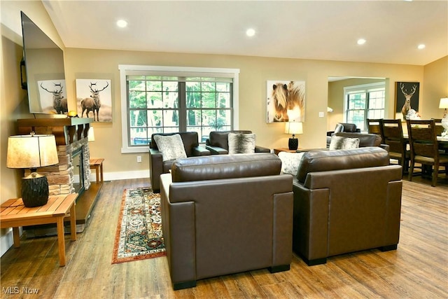 12 Bayview Cir, Cortland, OH 44410 - living area with wood finished floors, recessed lighting, and a stone fireplace