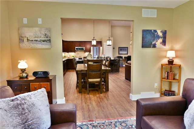 12 Bayview Cir, Cortland, OH 44410 - living room featuring light wood-style flooring and baseboards