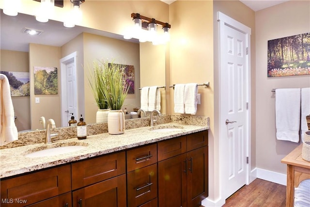 12 Bayview Cir, Cortland, OH 44410 - bathroom featuring wood finished floors and double vanity