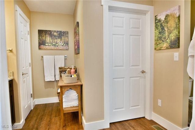12 Bayview Cir, Cortland, OH 44410 - hallway with dark wood-type flooring and baseboards