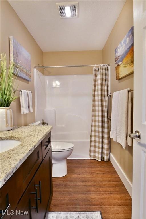 12 Bayview Cir, Cortland, OH 44410 - bathroom with vanity, wood finished floors, and shower / bath combo with shower curtain