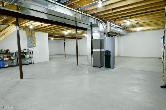 12 Bayview Cir, Cortland, OH 44410 - unfinished below grade area featuring water heater, heating unit, and electric panel