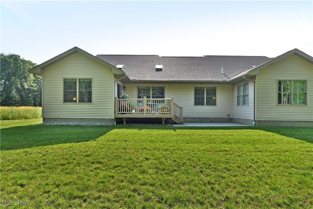 12 Bayview Cir, Cortland, OH 44410 - rear view of property with a deck, a lawn, a patio area, and a shingled roof