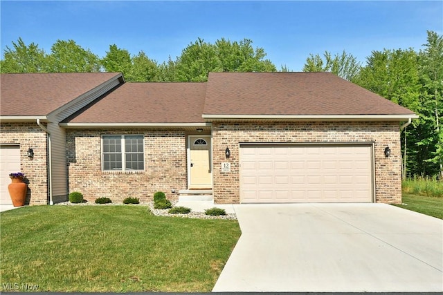 12 Bayview Cir, Cortland, OH 44410 - ranch-style house with brick siding, an attached garage, driveway, and a front yard