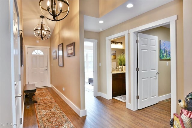 12 Bayview Cir, Cortland, OH 44410 - foyer with a chandelier, wood finished floors, and recessed lighting