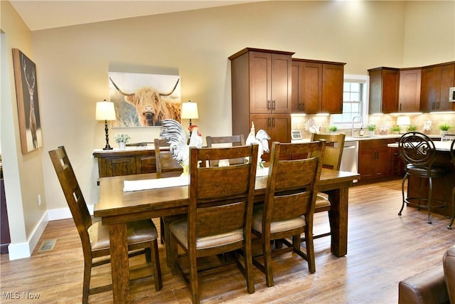 12 Bayview Cir, Cortland, OH 44410 - dining area featuring light wood-style floors and high vaulted ceiling