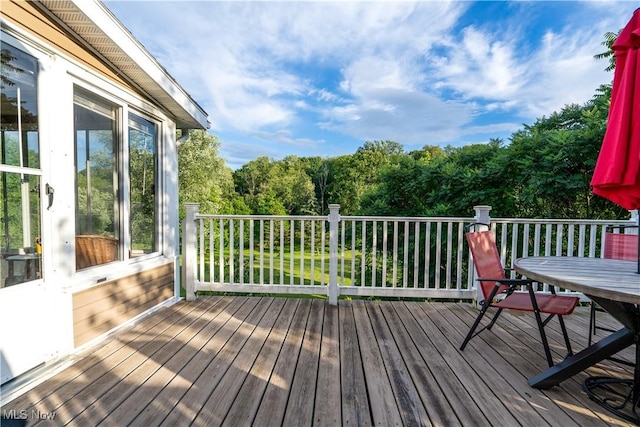 659 Lake Rd, Conneaut, OH 44030 - wooden deck with outdoor dining space