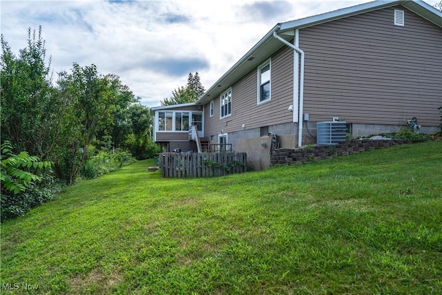 659 Lake Rd, Conneaut, OH 44030 - view of property exterior with a sunroom and a lawn
