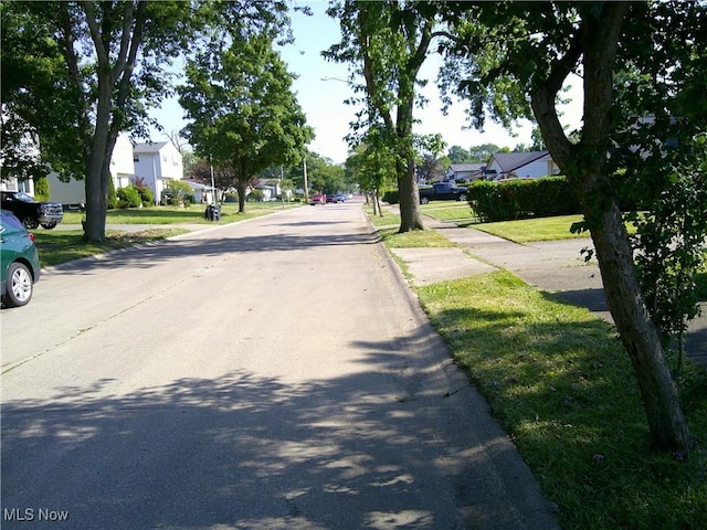 1064 E 168th St, Cleveland, OH 44110 - view of road with a residential view and curbs