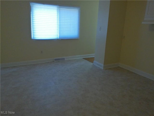 1064 E 168th St, Cleveland, OH 44110 - empty room featuring baseboards