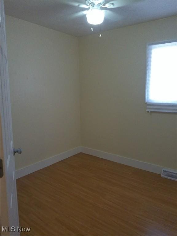 1064 E 168th St, Cleveland, OH 44110 - unfurnished room featuring light wood-style floors and a ceiling fan