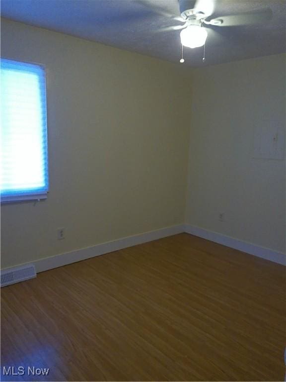 1064 E 168th St, Cleveland, OH 44110 - spare room featuring wood finished floors and ceiling fan
