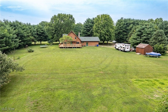 5621 Schustrich Rd, Mantua, OH 44255 - view of green lawn featuring a shed and a wooden deck