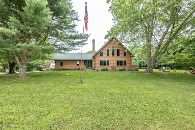 5621 Schustrich Rd, Mantua, OH 44255 - cabin featuring log siding, a front yard, and a chimney