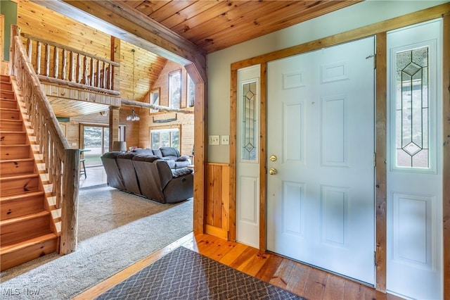 5621 Schustrich Rd, Mantua, OH 44255 - entryway featuring wooden ceiling, plenty of natural light, hardwood / wood-style flooring, wainscoting, and stairs