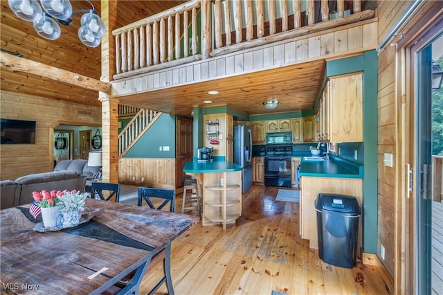 5621 Schustrich Rd, Mantua, OH 44255 - dining area with wood walls, light wood-type flooring, a towering ceiling, and wooden ceiling