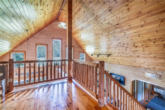 5621 Schustrich Rd, Mantua, OH 44255 - additional living space with wood walls, wood ceiling, wood-type flooring, and vaulted ceiling