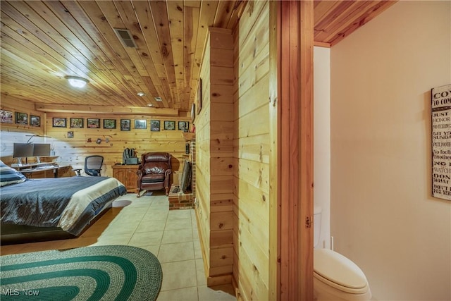 5621 Schustrich Rd, Mantua, OH 44255 - bedroom with wood walls, wooden ceiling, and tile patterned floors