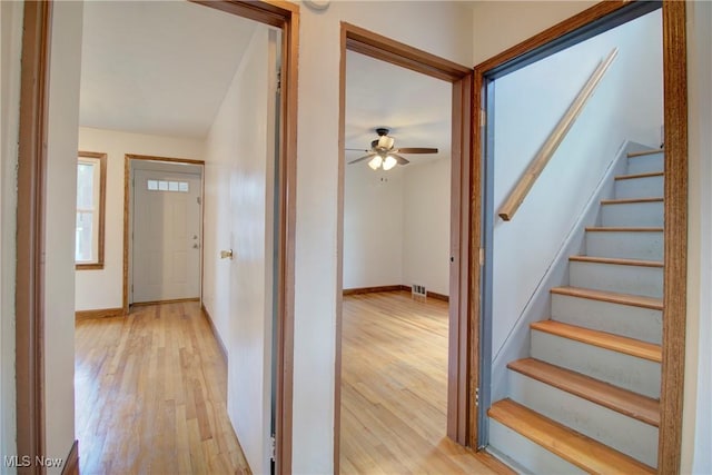 8102 Bertha Ave, Parma, OH 44129 - foyer entrance featuring light wood-style flooring, stairway, and a ceiling fan