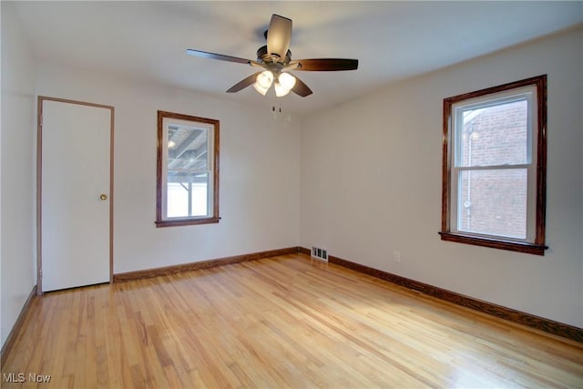 8102 Bertha Ave, Parma, OH 44129 - empty room featuring light wood finished floors and a ceiling fan