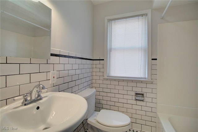 8102 Bertha Ave, Parma, OH 44129 - full bath featuring tile walls, healthy amount of natural light, and shower / bathtub combination