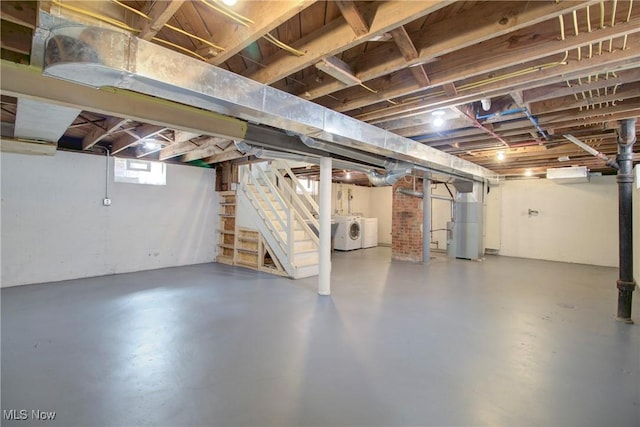 8102 Bertha Ave, Parma, OH 44129 - basement featuring washer and clothes dryer, stairs, and water heater
