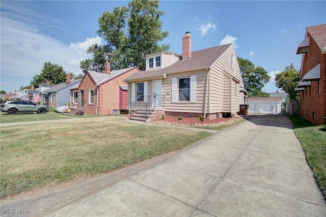 8102 Bertha Ave, Parma, OH 44129 - view of front of home with a chimney, a front yard, and a detached garage