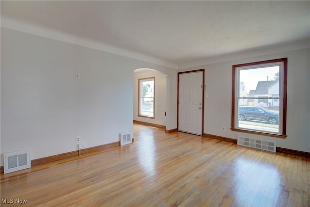 8102 Bertha Ave, Parma, OH 44129 - unfurnished room featuring arched walkways and light wood-style floors