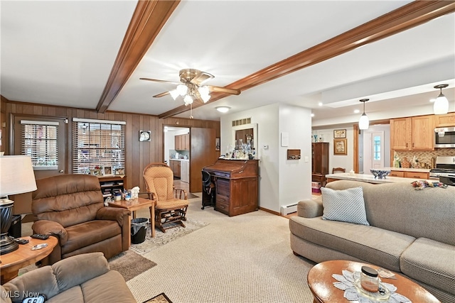 136 Elmridge Rd, Mansfield, OH 44907 - living room featuring light colored carpet, ceiling fan, beamed ceiling, wooden walls, and baseboard heating