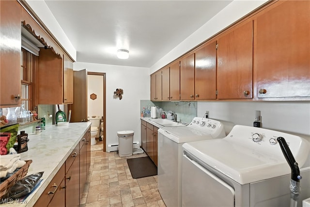 136 Elmridge Rd, Mansfield, OH 44907 - washroom featuring stone finish floors, washer and dryer, and a baseboard radiator