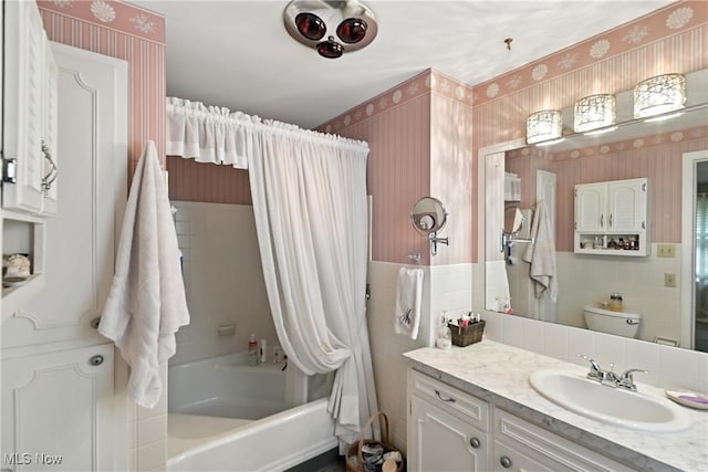 136 Elmridge Rd, Mansfield, OH 44907 - full bathroom featuring wallpapered walls, shower / tub combo, vanity, and tile walls