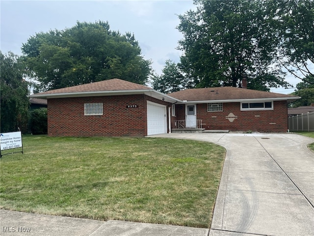 8375 Royal Ridge Dr, Parma, OH 44129 - single story home with brick siding, a garage, and driveway