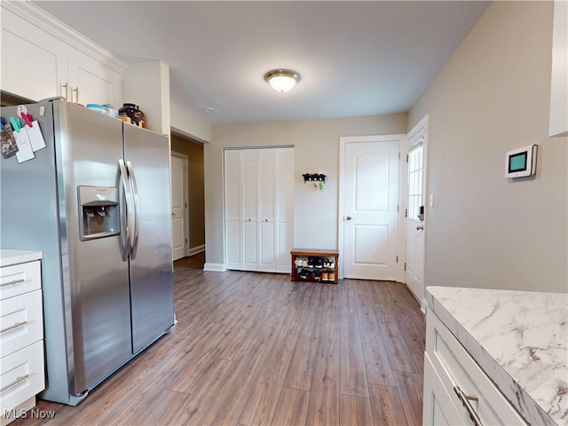 1345 E 359th St, Eastlake, OH 44095 - kitchen featuring stainless steel fridge, wood finished floors, and white cabinetry
