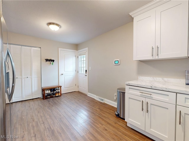 1345 E 359th St, Eastlake, OH 44095 - washroom with cabinet space and light wood-style flooring