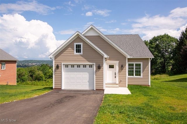 77 Retilley Dr, Coshocton, OH 43812 - view of front facade with a front lawn, driveway, a garage, and roof with shingles