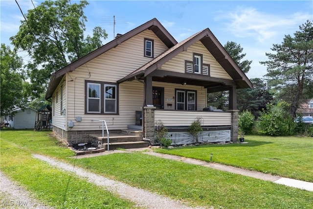 1029 S Main St, Grafton, OH 44044 - view of front facade featuring covered porch and a front yard
