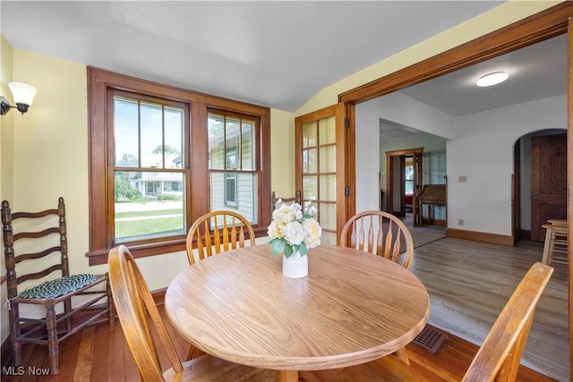 1029 S Main St, Grafton, OH 44044 - dining space featuring arched walkways, wood finished floors, and lofted ceiling