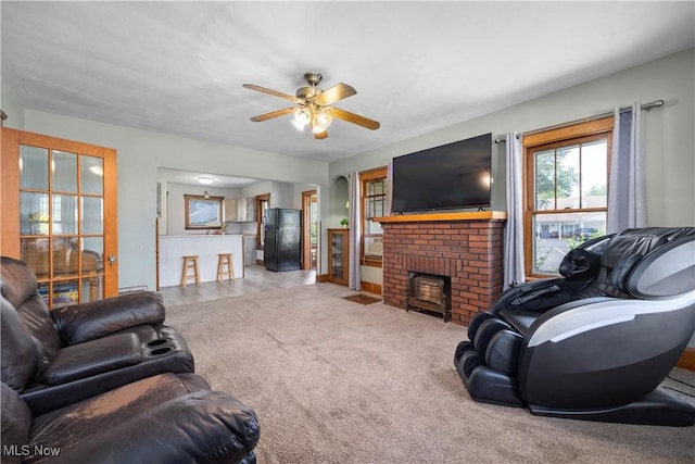 1029 S Main St, Grafton, OH 44044 - carpeted living room with ceiling fan and a fireplace