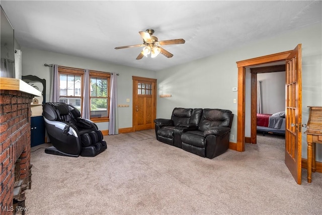 1029 S Main St, Grafton, OH 44044 - living area with ceiling fan, a brick fireplace, and carpet floors