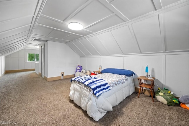 1029 S Main St, Grafton, OH 44044 - bedroom with carpet floors, vaulted ceiling, and a decorative wall