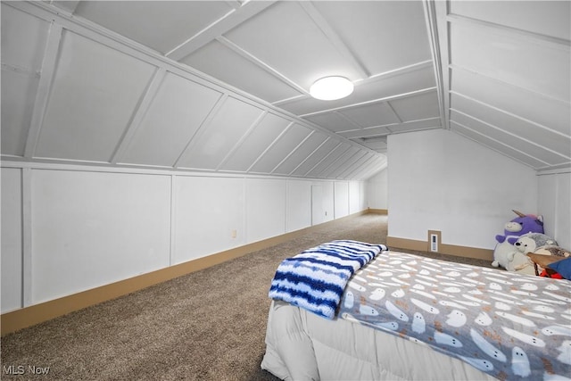 1029 S Main St, Grafton, OH 44044 - carpeted bedroom featuring lofted ceiling and a decorative wall