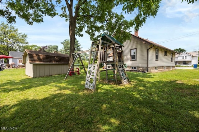 1029 S Main St, Grafton, OH 44044 - view of playground featuring a storage shed and a lawn
