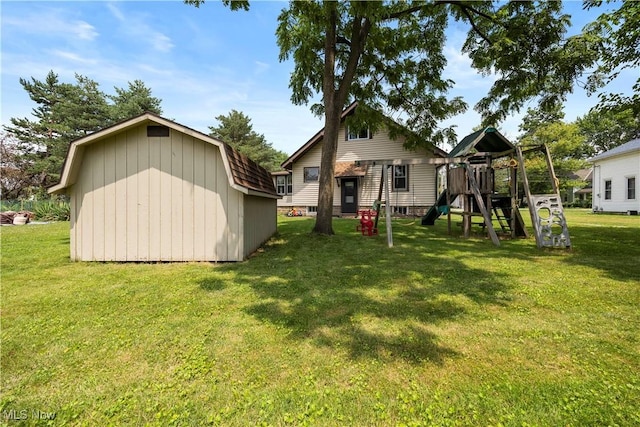 1029 S Main St, Grafton, OH 44044 - rear view of house with a playground, a yard, and an outdoor structure