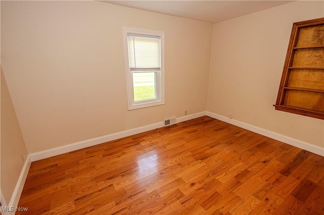 9306 Beech St, Louisville, OH 44641 - unfurnished room with wood finished floors and baseboards