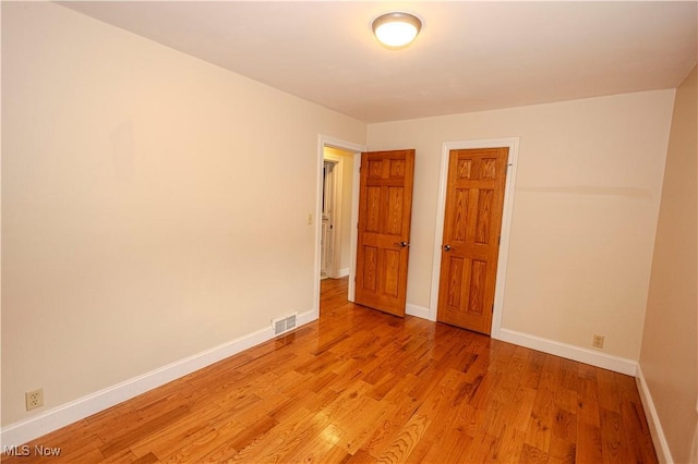 9306 Beech St, Louisville, OH 44641 - spare room with baseboards and light wood-type flooring